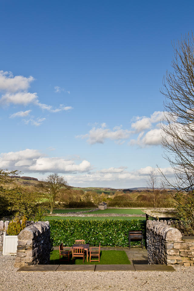 Steps down to the sunken garden with views towards Longstone Edge