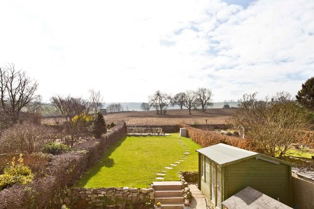 Large enclosed garden with far reaching views to the rear and decked terrace for al freso dining