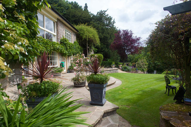 River Cottage has a beautiful garden with a river setting