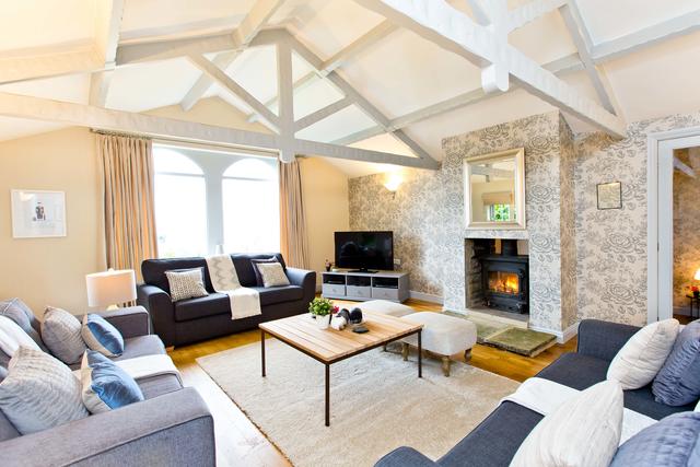 Beautiful lounge with cosy log burner