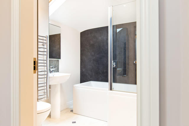 Bedrooms 4 & 5 shared family bathroom with shower over bath