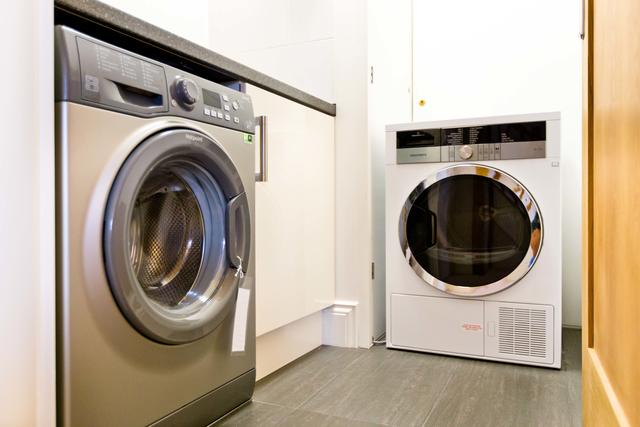 Coin-operated washing machine and tumble dryer