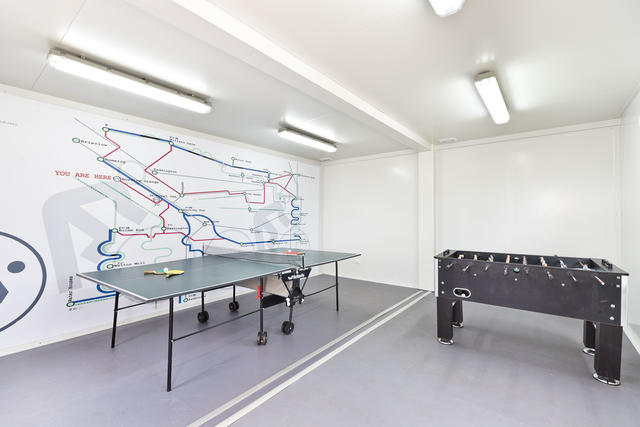 A separate communal games room for all site