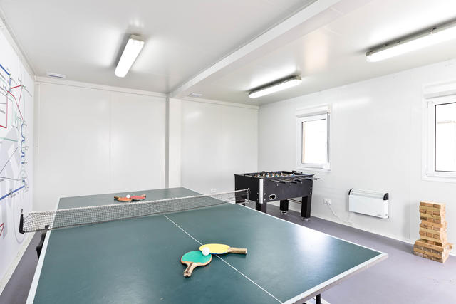 A separate communal games room for all of site