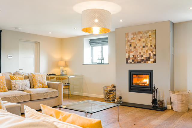 The inset log burner provides a great focal point in the open plan space