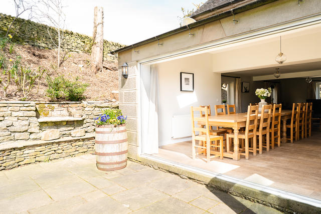 View from the side patio looking into the dining room - open the bifold doors on a sunny door for views of the garden