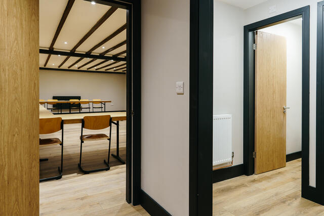 View into the meeting space/games room, with two WC's located to the side of the entrance