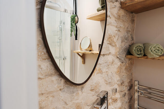 Ensuite with feature stone wall