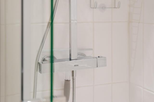 Overhead shower with hand held shower attachment