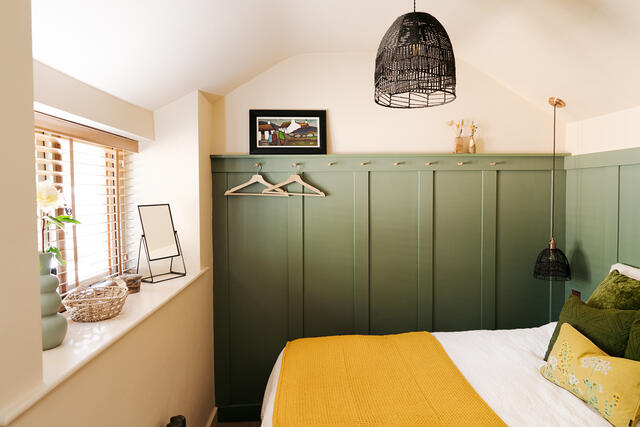Bedroom 2 fixed double with striking green panelling