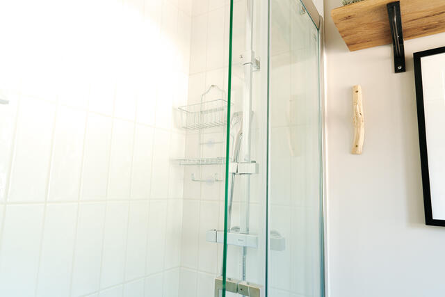 Overhead shower with separate hand held shower attachment