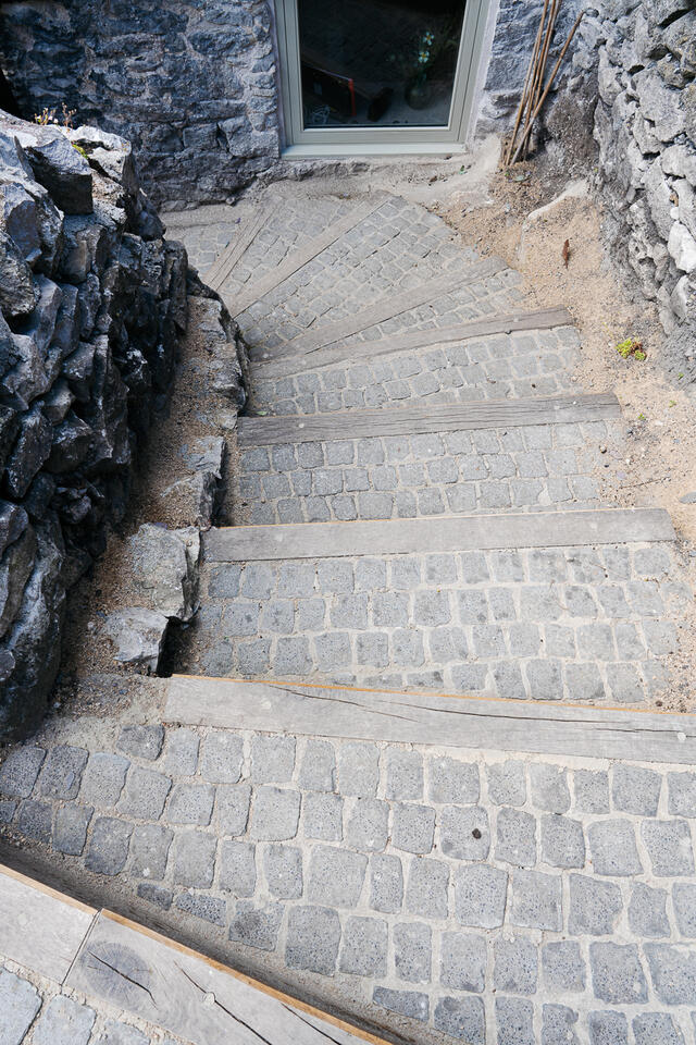 Cobbled steps down to the small courtyard