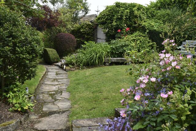 The garden leading from the carport to the cottage