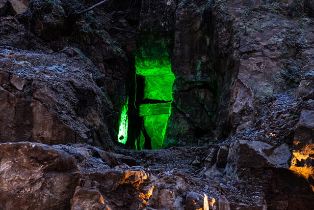 Lit up cave behind the apartments