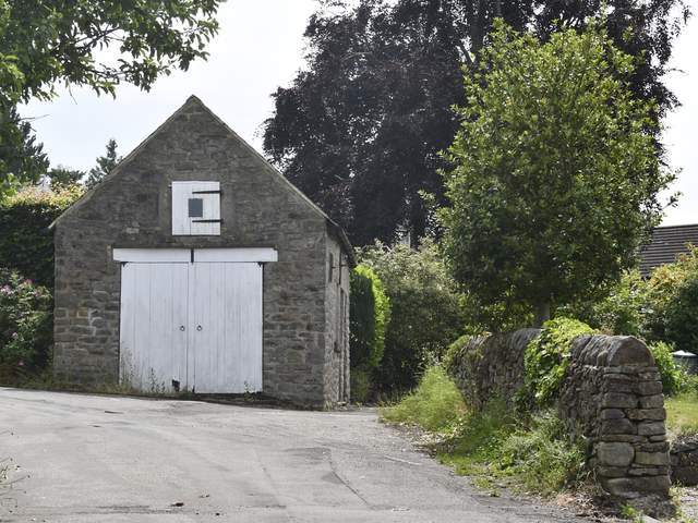 Take the lane to the right of this garage for the cottage