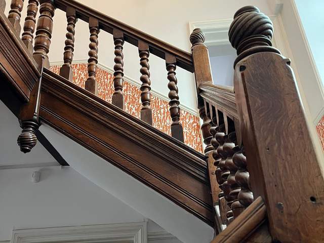 Hand carved bannister stairway