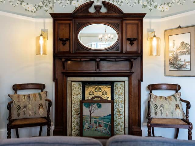 Striking decorative fireplace in the garden room