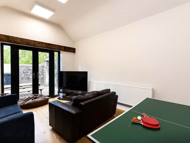 Table tennis and seating in the games room