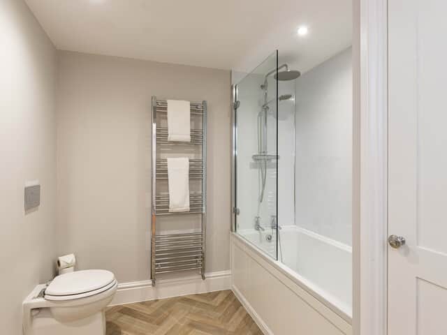 Bedroom 9 en suite with shower over bath