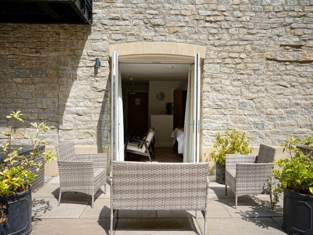 Rock Mill Apartment 9 has comfortable outdoor seating for guests to use