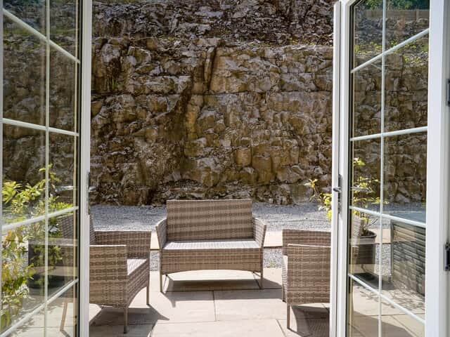 Rock Mill Apartment 9 patio doors onto the outdoor seating area