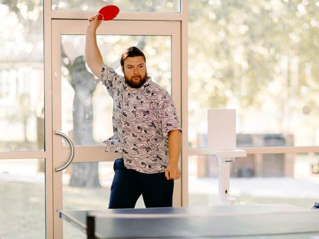 Guest playing table tennis