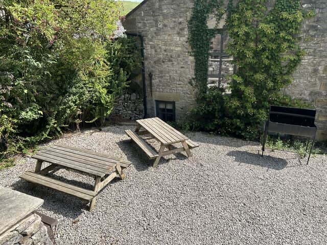 BBQ area with picnic benches