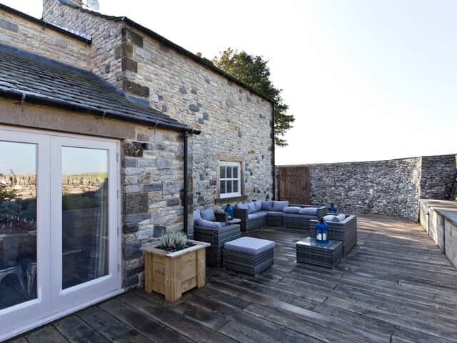 The Farmhouse decked seating area with Rattan seating