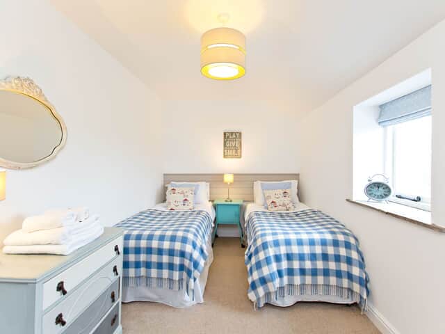 The Barn bedroom 2 with shower over bath en suite