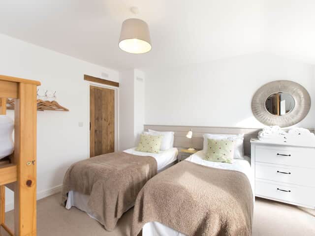 The Barn bedroom 5 with bunk beds & shower over bath en suite