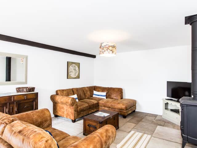 The Barn lounge with log burner