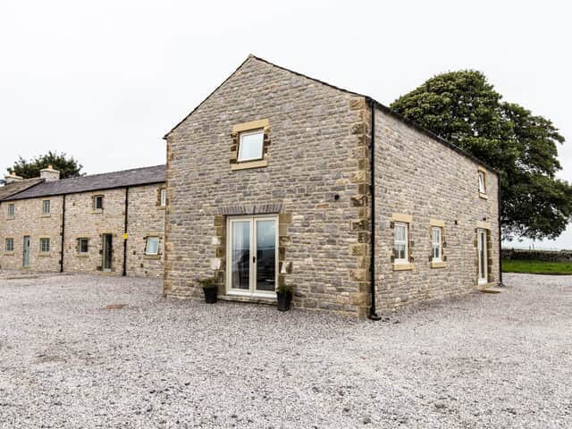 The Barn property with lawn behind
