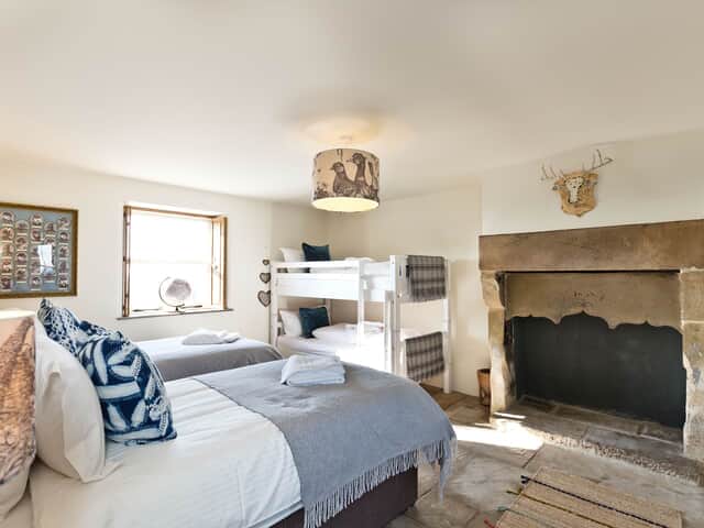 The Farmhouse ground floor bedroom 1 with bunk beds