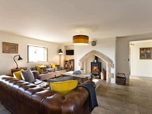 The Farmhouse lounge area with log burner
