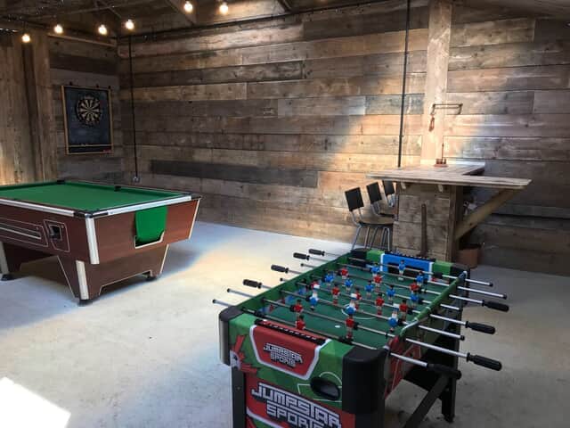 The Barn games room with pool table and table football