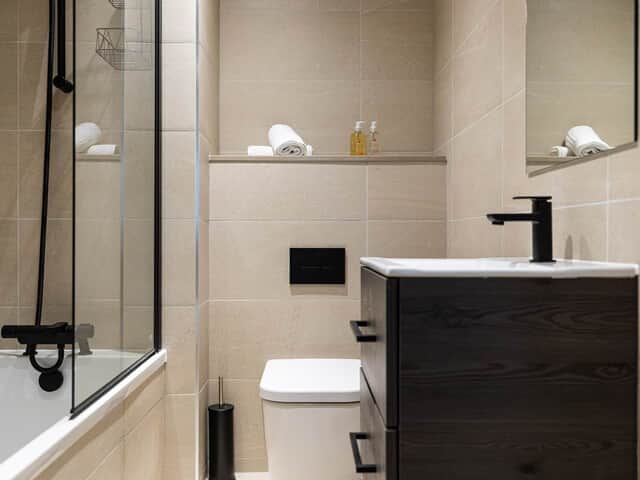 Bathroom with shower over bath